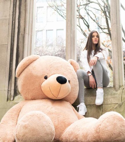 cool girl posing with giant teddy