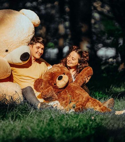 adorable couple playing with teddy bears bigted